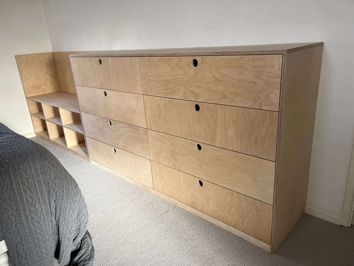 Birch plywood chest of drawers with open cubby shelving, built to fit the room