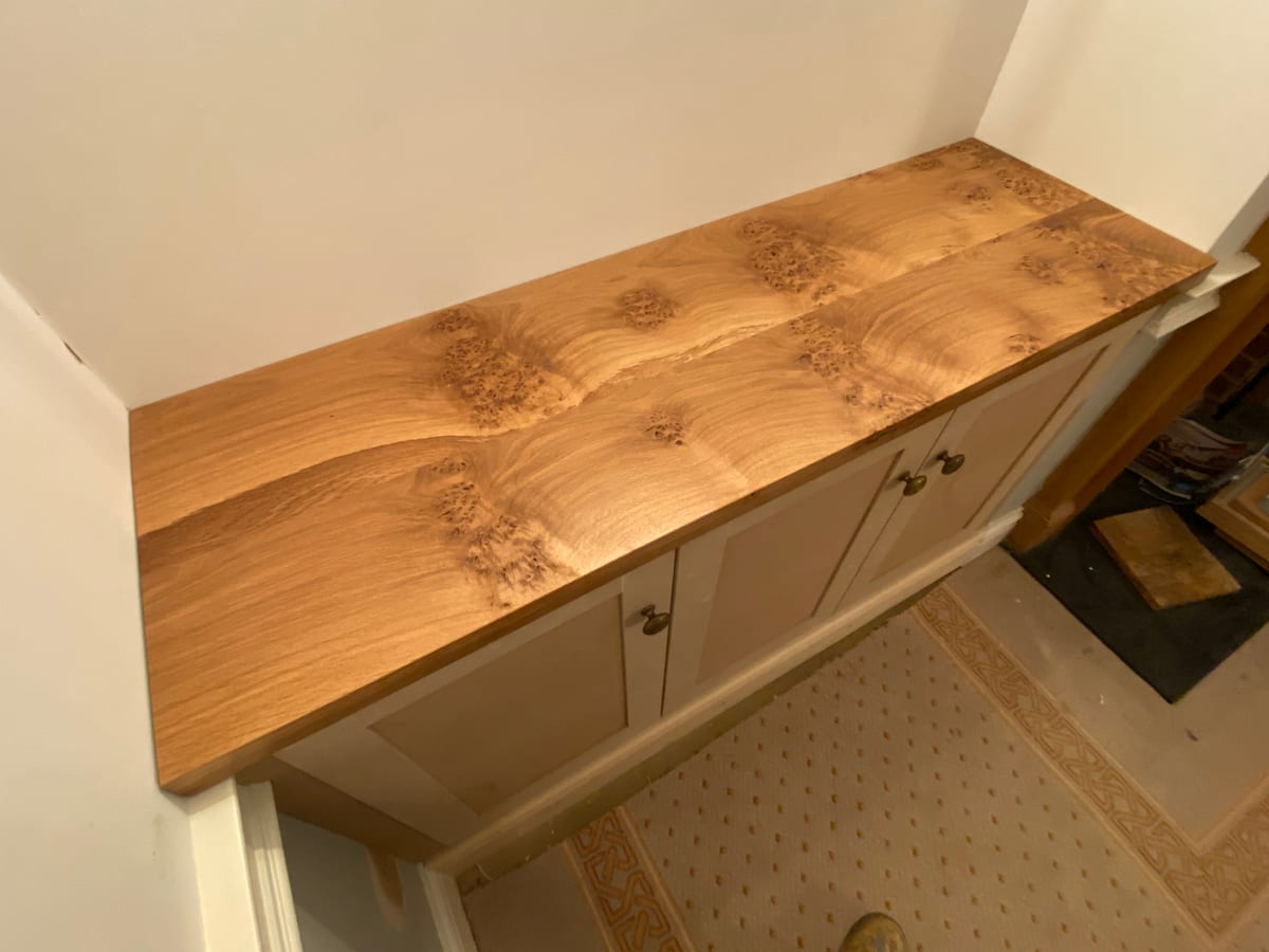 Burr oak surface with a live figured grain fitted along a staircase