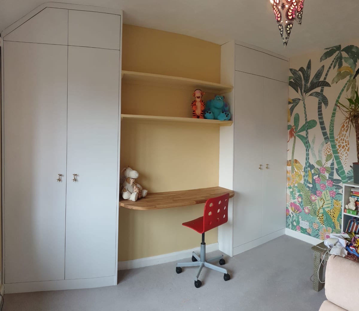 Fitted children's wardrobe and corner desk with shelving above